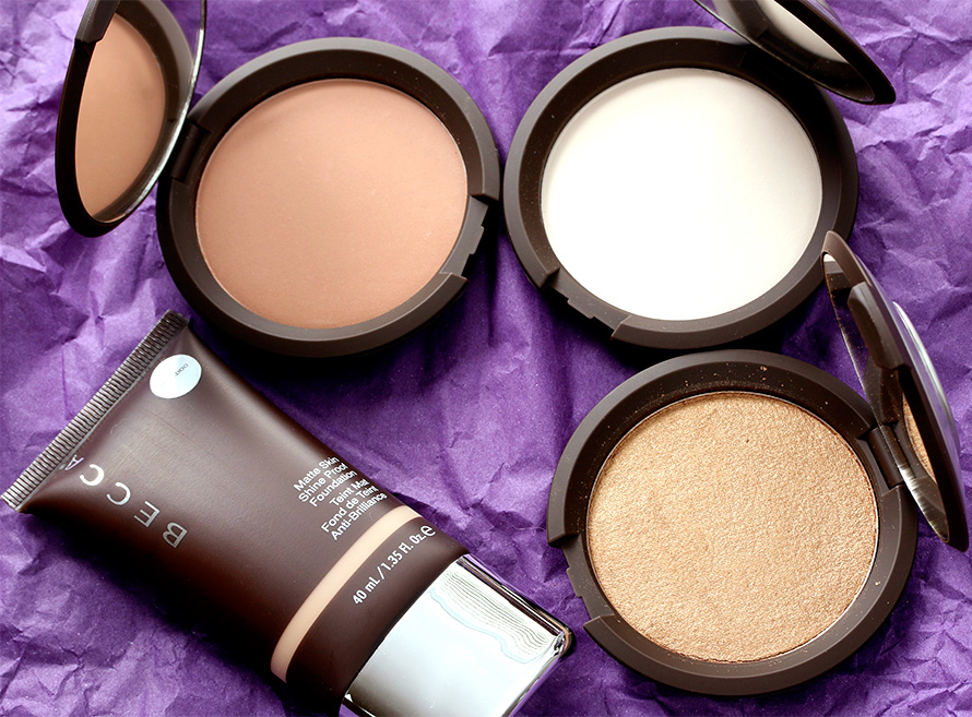 BECCA products, clockwise from the lower left: Matte Skin Shine Proof Foundation in Bamboo, Blotting Powder Perfector in Tinted, Blotting Powder Perfector in Translucent and Shimmering Skin Perfector Pressed in Topaz