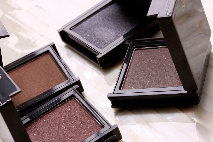 Jouer Powder Eyeshadows in clockwise from the lower left corner: Mahogany, Walnut, Caviar and Espresso
